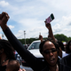 Members of the crowd cheer when a group of black motorcyclists circled the street outside a memorial and public viewing for George Floyd on June 6, 2020 in Fayetteville, North Carolina.